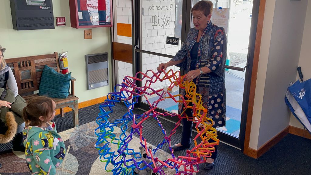 Donna working with students at Inly School